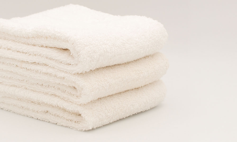 ホテルランドリーで洗濯した清潔なタオルのイメージ